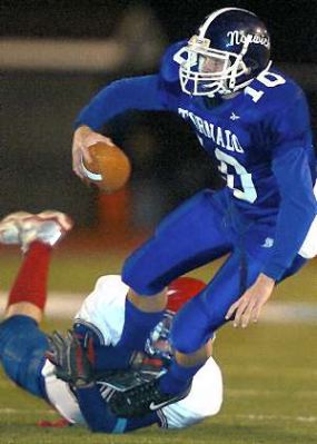 Norwich's Jordan Alger is hauled down by the Forks' Steve Samson during the first quarter 