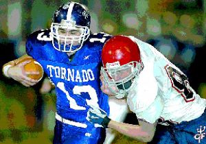 Norwich's Mike Abbott is stopped by Chenango Forks' Zach Vredenburgh in the fourth quarter of Friday night's Class B championship game at Binghamton Alumni Stadium.