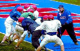 The Blue Devils defensive coach Dave Chickanosky oversees preparations for the upcoming Class B championship game during practice at Alumni Stadium in Binghamton.