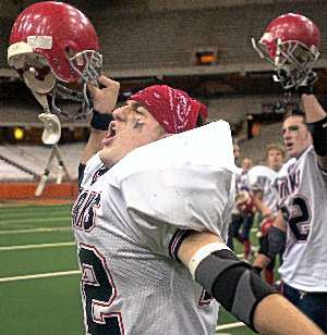 Matt Stephens whoops it up teammates Saturday after the Blue Devils beat Rye 16-0 to win the New York state Class B championship at the Carrier Dome in Syracuse.