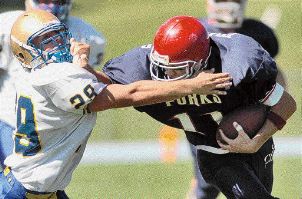 Rick Mirabito uses his arm to fend off Maine-Endwell's Jon Kolba in the second quarter of the game at Blue Devil Stadium. - photo by  DIOGENES AGCAOILI JR. / Binghamton Press & Sun-Bulletin