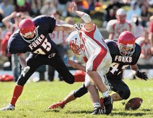 CF's Chris Kwartler, left, and Alex Sabo, and Chenango Valley's Trevor Cola try to pounce on a muffed punt on Saturday. CF recovered and scored three plays to take a 21-0 lead in the final minute of the first half.  WAYNE HANSEN / Press & Sun-Bulletin