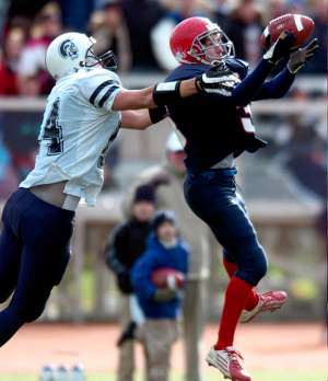 Chenango Forks' Dylan Rittenburg, right, tries to intercept a pass intended for Homer's Mike Carboine in the second quarter of Friday's state Class B quarterfinal at Ty Cobb Stadium.- DIOGENES AGCAOILI JR. / Press & Sun-Bulletin