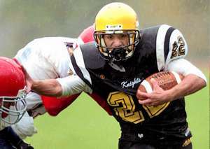 Windsor's Cody Whitman, right, evades a tackle from Chenango Forks' Alex Sabo, left, and Rick Mirabito before running out of bounds in the first quarter of Saturday's game. Forks beat Windsor, 21-14. REBECCA TOWNS / Press & Sun-Bulletin