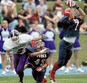 Bryan Lance, right, cuts past teammate Alex Sabo and Norwich's Ryan Benenati for an interception in the second quarter of Saturday's game at Chenango Forks. Forks stretched its winning streak to 29 straight with a 28-14 victory. DIOGENES AGCAOILI JR. / Press & Sun-Bulletin