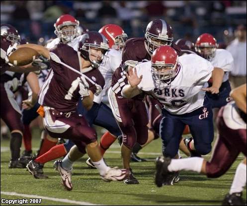 Corning East's Mitch Keefer tries to avoid Chenango Forks' Jud DuBois in the first quarter of Forks 15-12 victory Friday night at Corning.