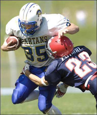 Tim Zdimal of Chenango Forks wraps around Dan Reynolds of Maine-Endwell in the second quarter 